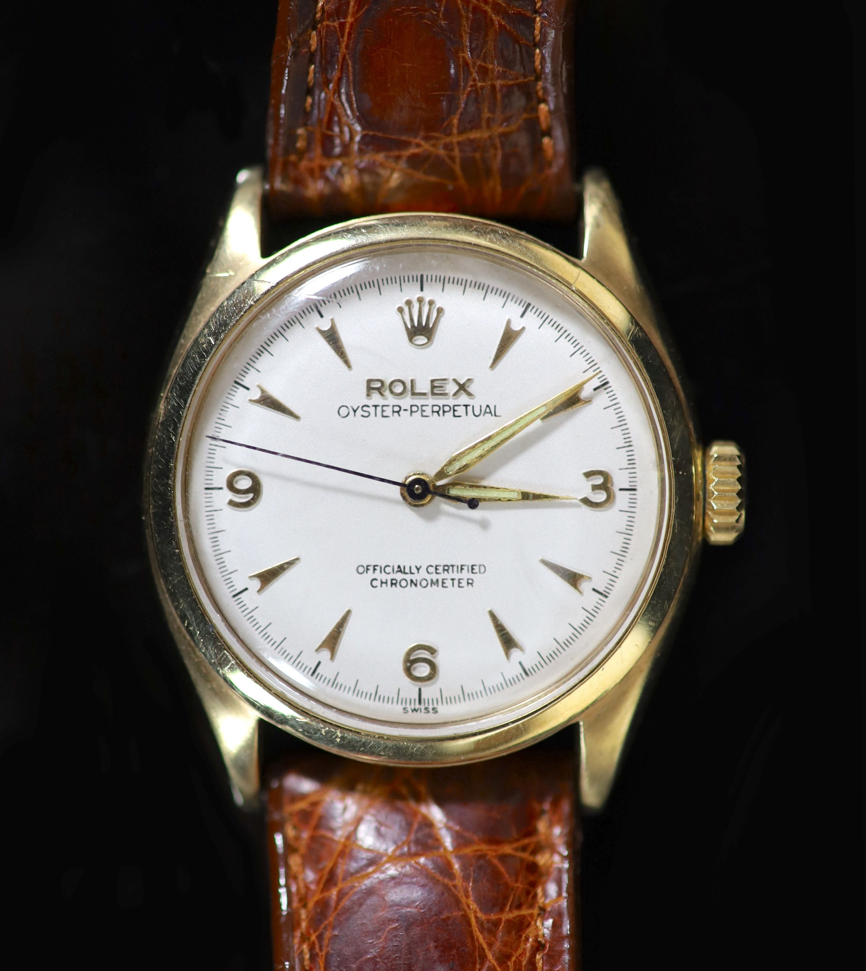 A gentleman's early 1950's 9ct gold Rolex Oyster Perpetual bubbleback wrist watch, on a leather strap with gold plated Rolex buckle